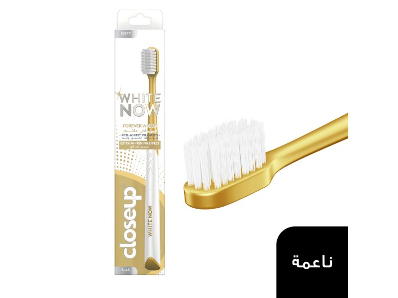 Closeup toothbrush white now soft gold